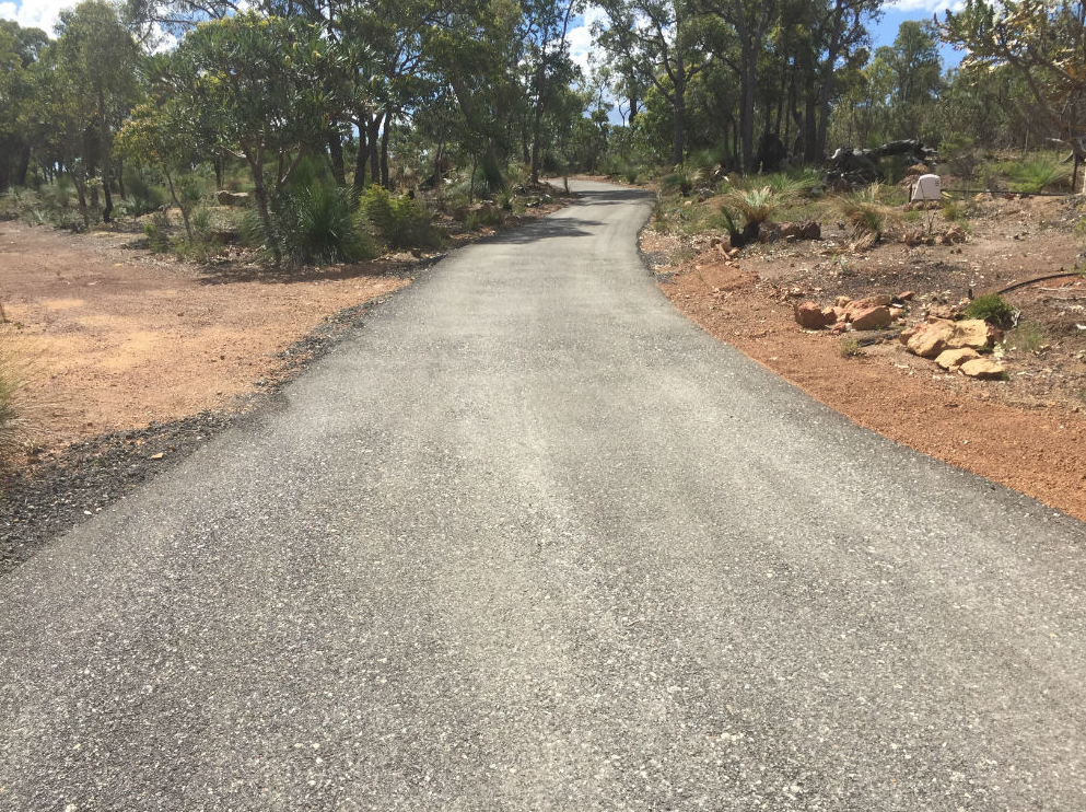 This is a photo of a hot spray & seal bitumen driveway which is in the process of being installed by Shepparton Surfacing Solutions